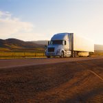 Freight Forwarding Truck on highway at sunset