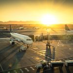 Airplane at international airport terminal gate ready for takeoff